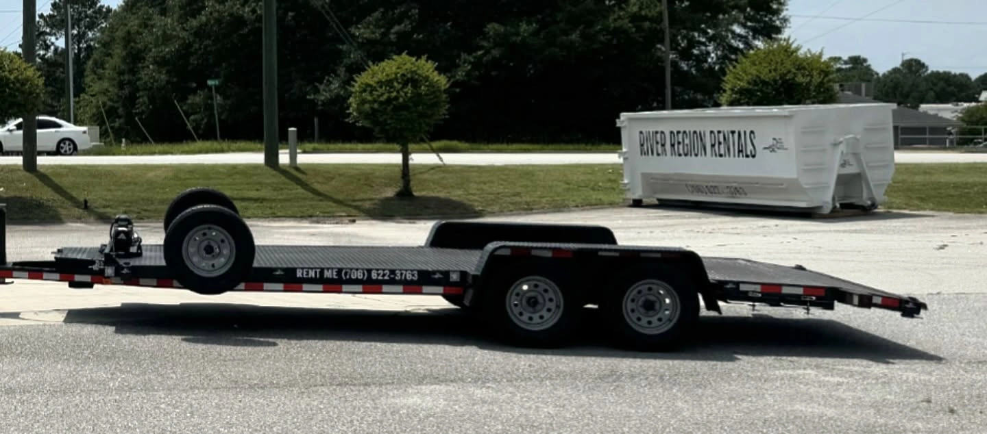 Dumpsters and trailers on the road